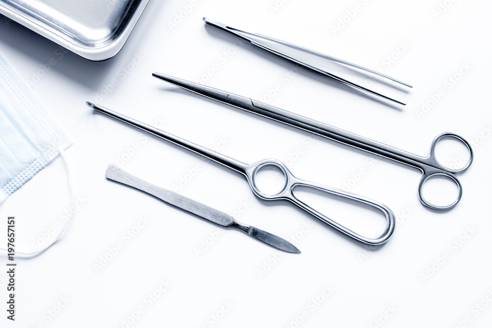 instruments for plastic surgery on white background top view