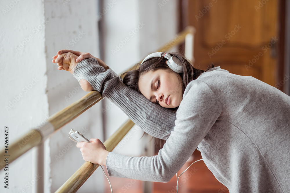 Young ballerina on training indoors