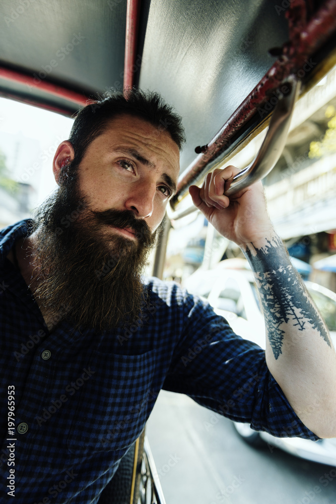 Hipster man riding a public transport