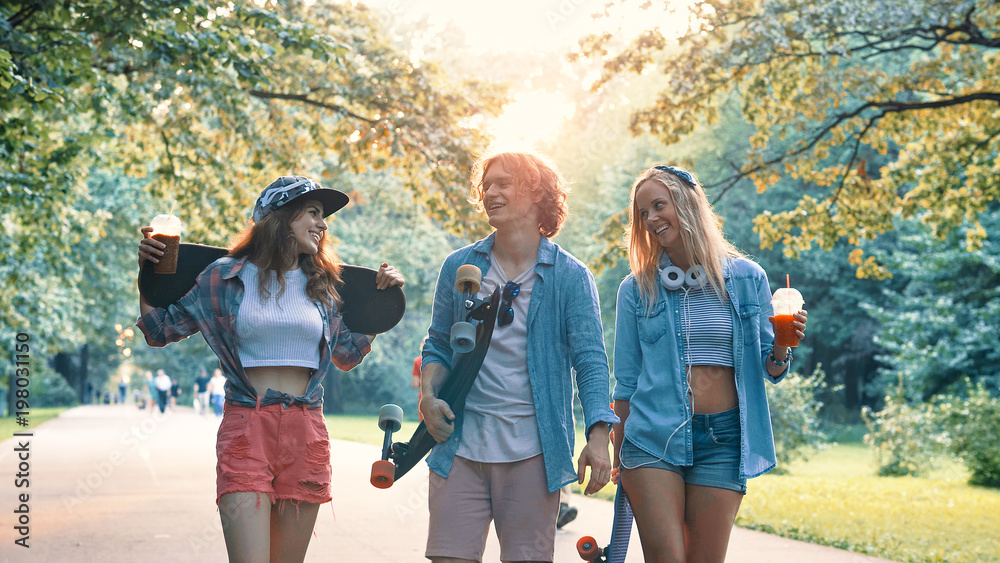 Smiling skateboarders in the park