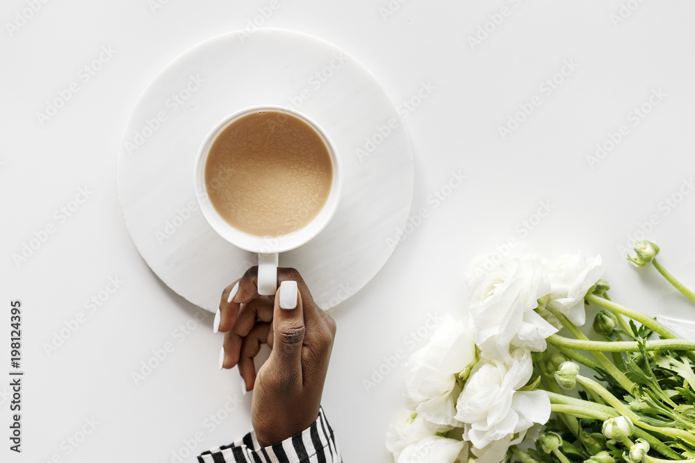 Aerial view of black woman drinks coffee