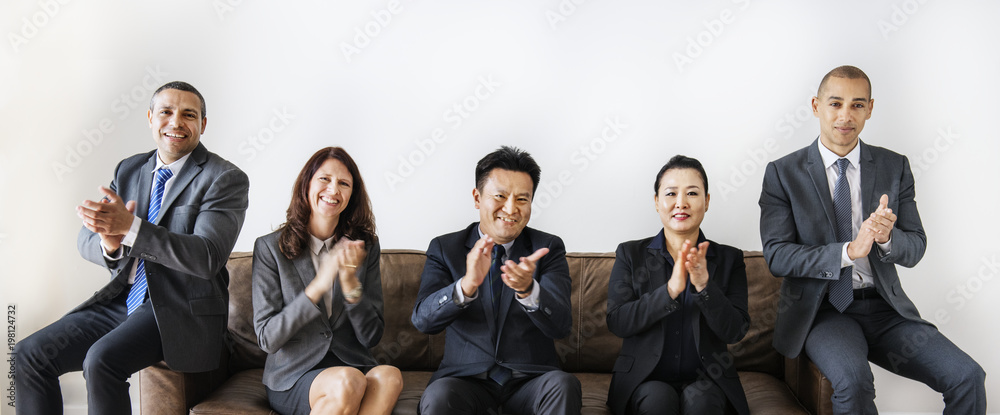 Business people sitting together on couch