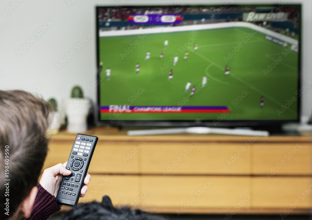 Couple watching a football game on TV