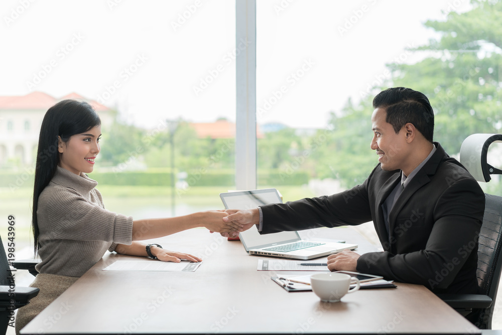 Meeting and greeting concept, Two Asian confident Business handshake and business people after discu