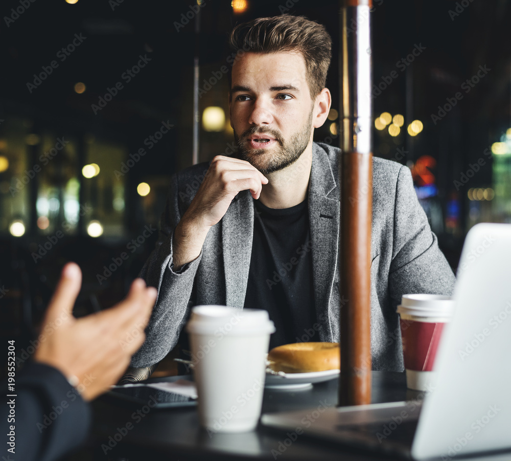 Business partners working together at a cafe