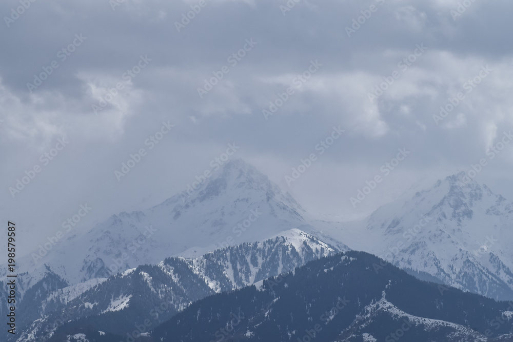 Rainy weather, view of the mountains through a window. Almaty, Kazakhstan, Qazaqstan.