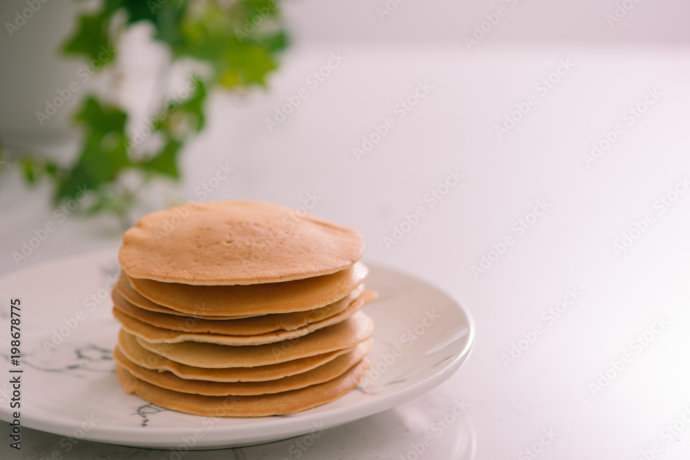 Cooking for breakfast. Delicious homemade pancakes on a plate