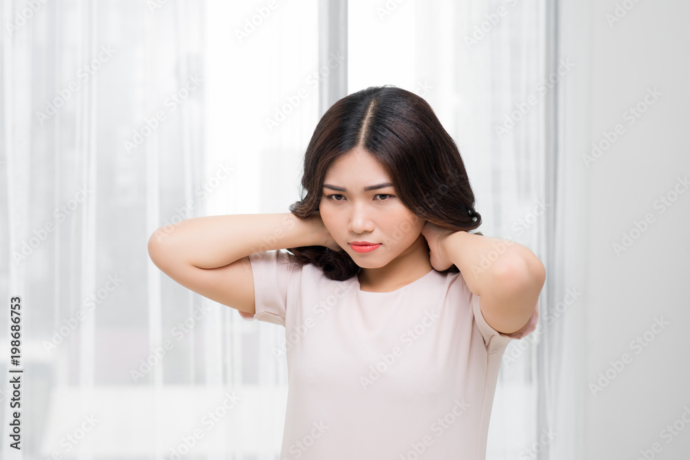 Tired woman having pan in neck