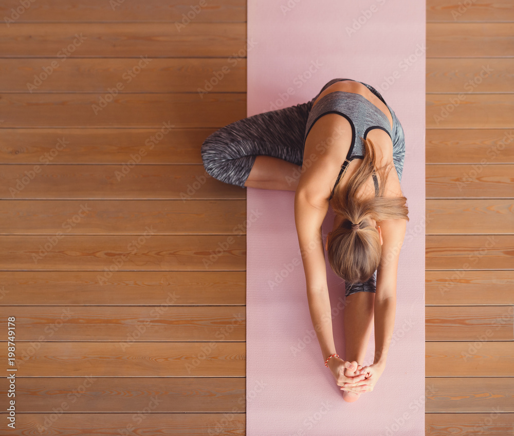 Young woman practicing gymnastics