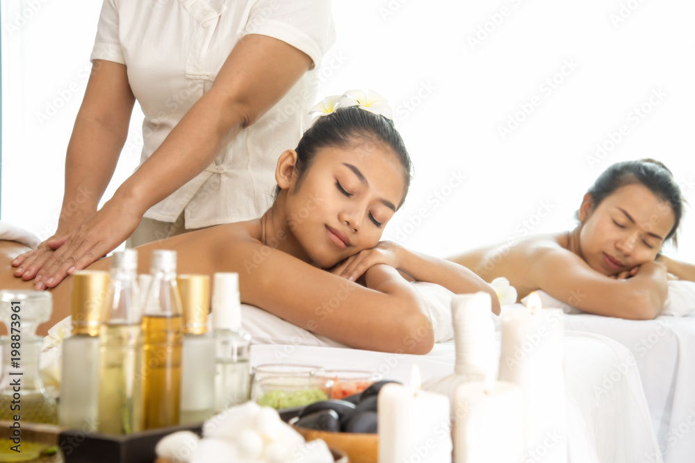 Two asia woman having massage at spa salon