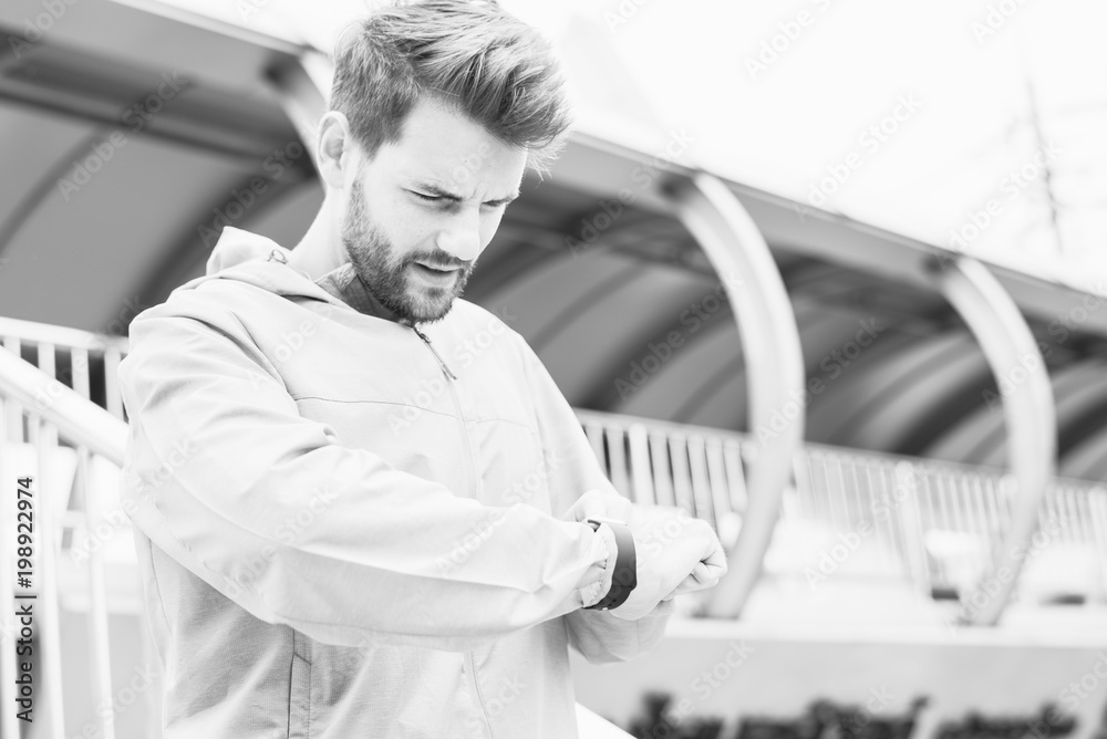 Busy man checking his watch