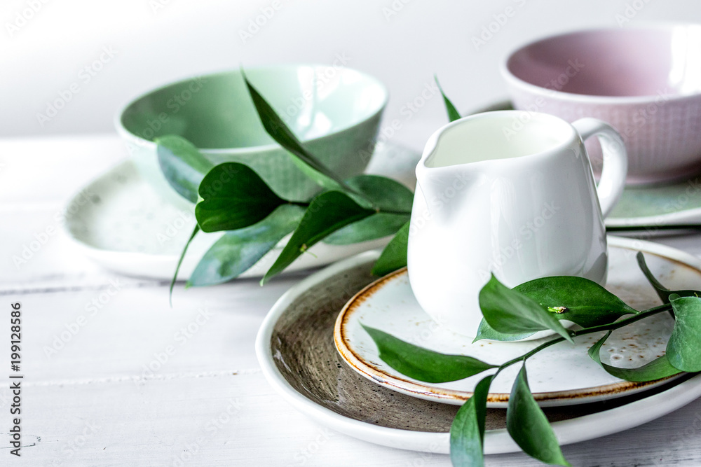 ceramic tableware with flowers on white background