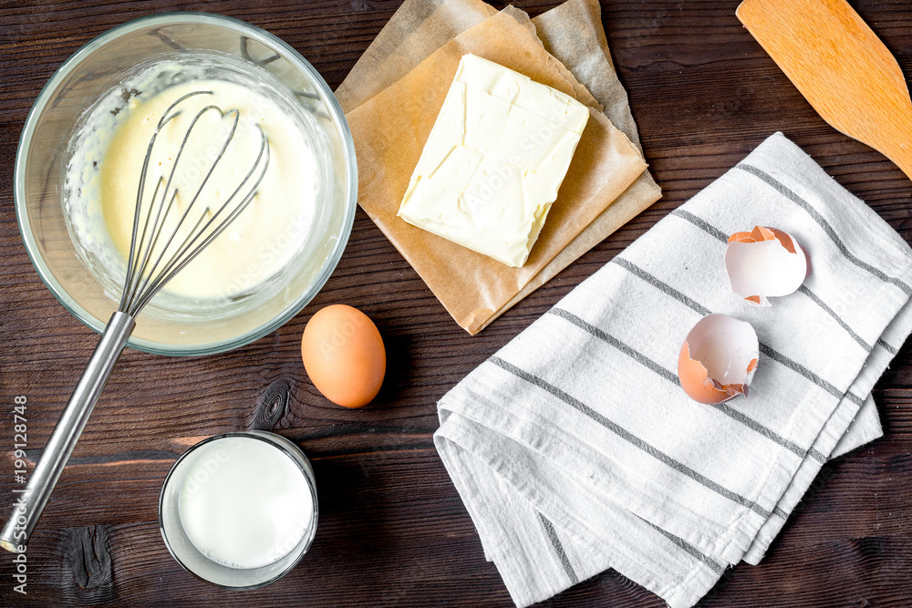 cooking pancake on wooden background top view ingredients for ma