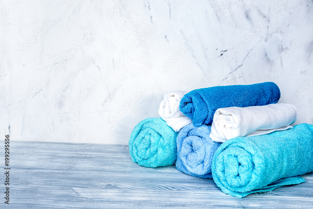 Towels pile in housekeeping set on laudry background mockup