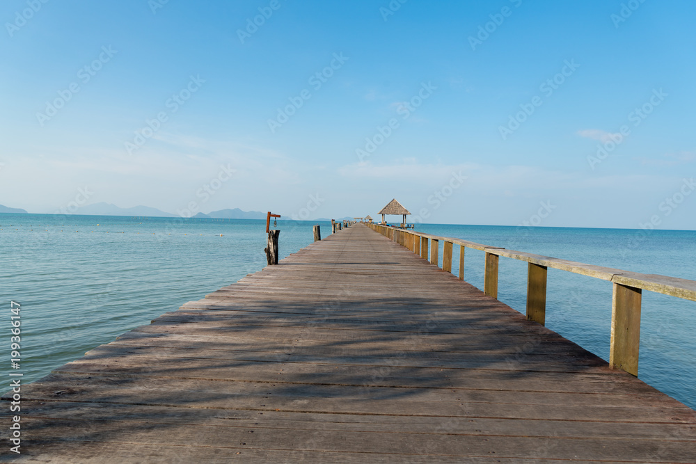 Wooden pier with boat in Phuket, Thailand. Summer, Travel, Vacation and Holiday concept.