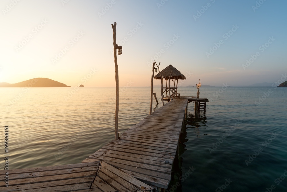 Wooden pier between sunset in Phuket, Thailand. Summer, Travel, Vacation and Holiday concept.