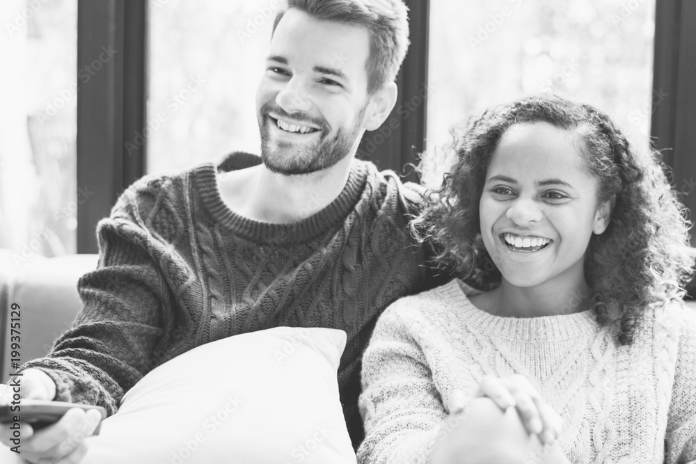 Couple watching tv on the sofa