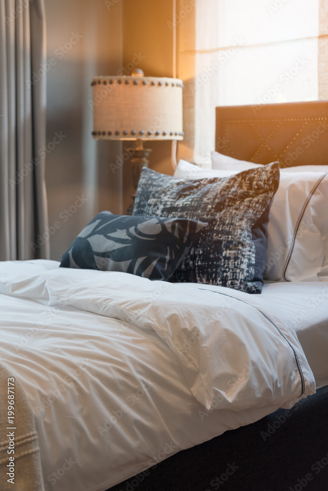 single bedroom with set of pillows on bed