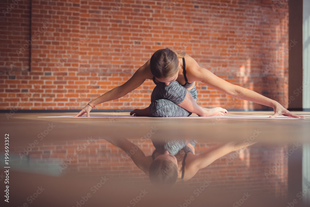 Young woman practicing yoga