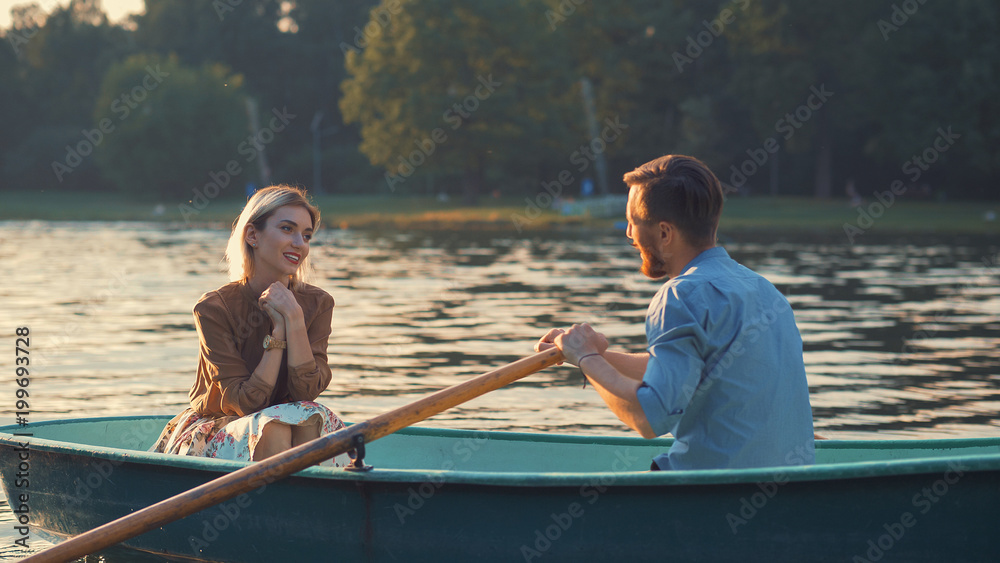 Young attractive couple in a boat