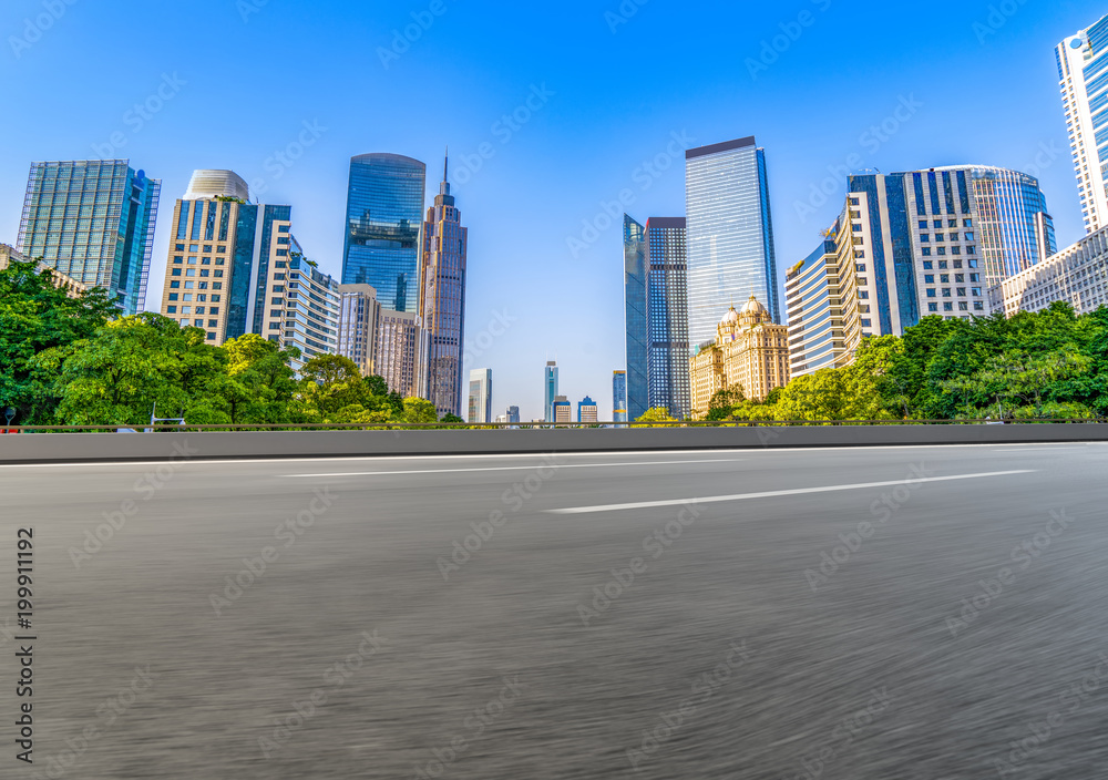 Through the empty asphalt pavement of modern cities in guangzhou, China.