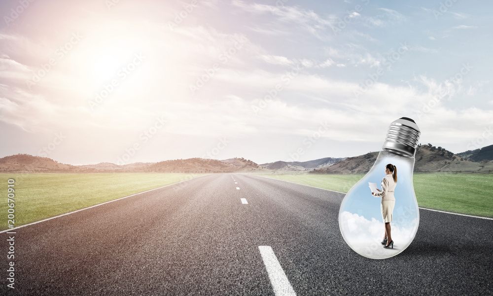 Businesswoman inside light bulb