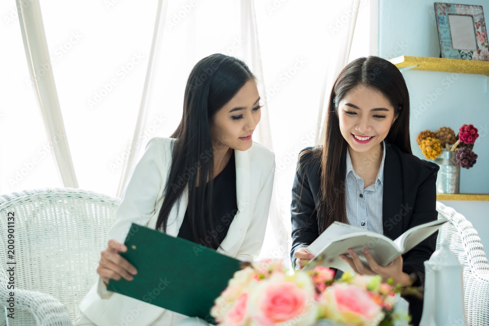 Young asian businesswoman in modern office, discussing business with colleague during meeting and in