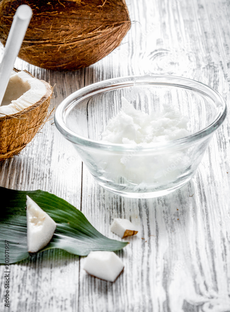 organic cosmetics with coconut on wooden background close up