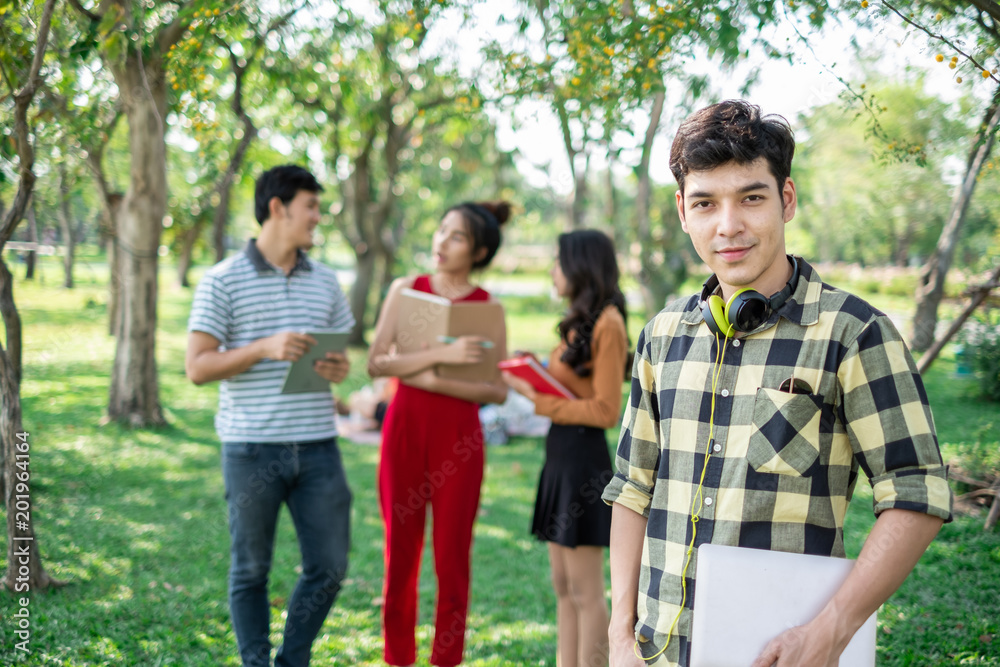 portrait asian young teen student standing in park for studying and education concept