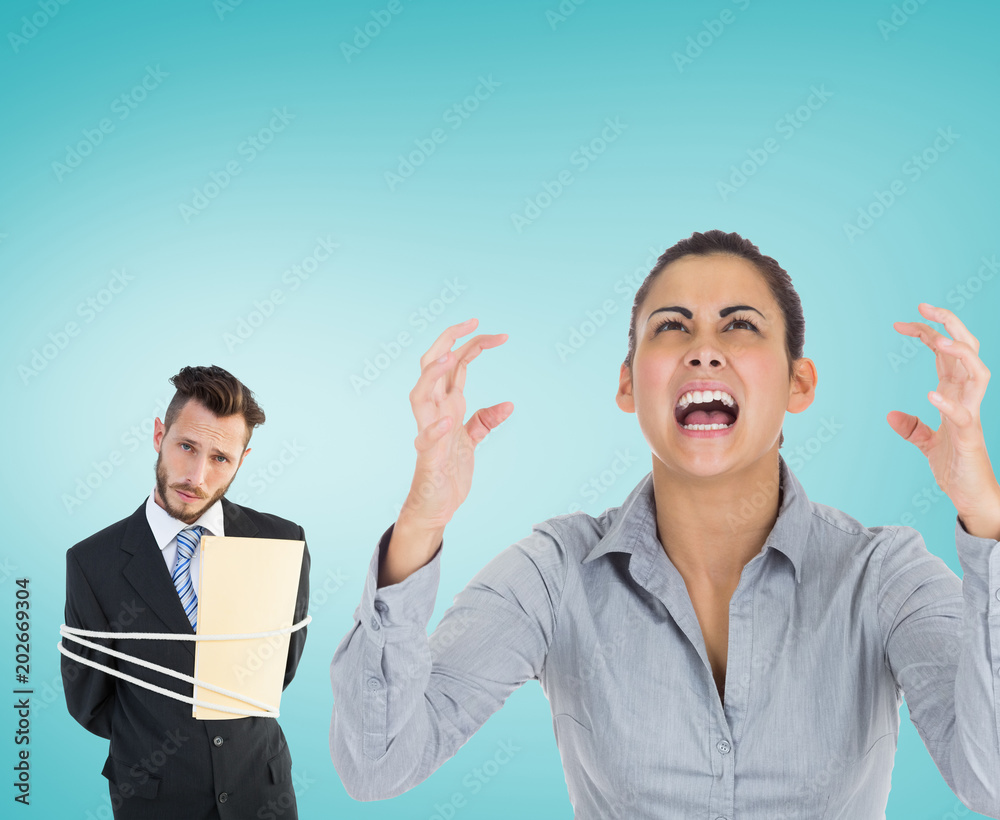 Furious businesswoman gesturing against blue vignette background