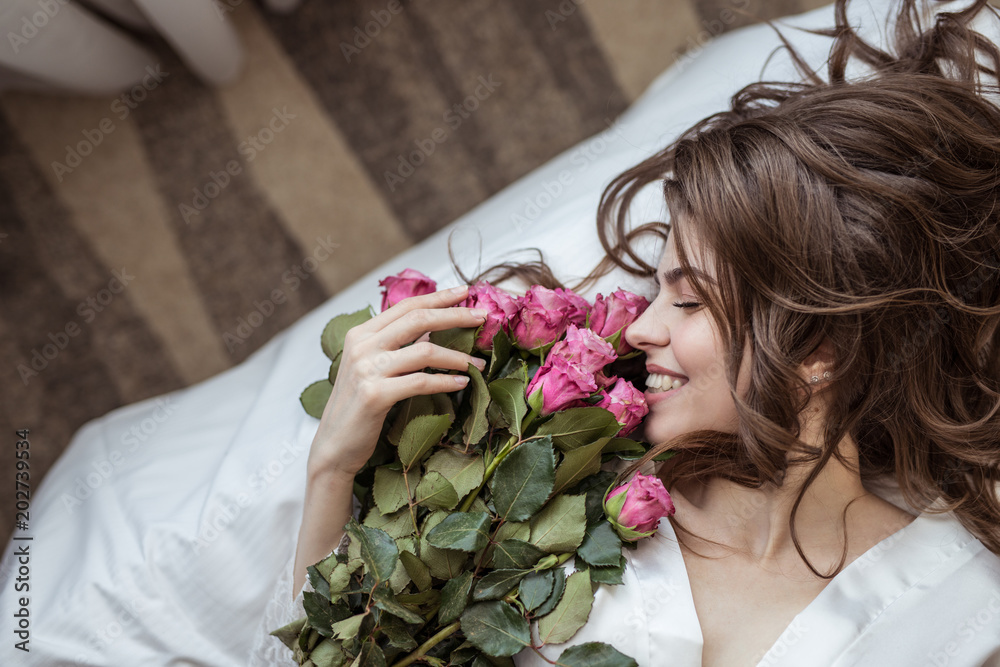 Happy girl with bouquet of flowers