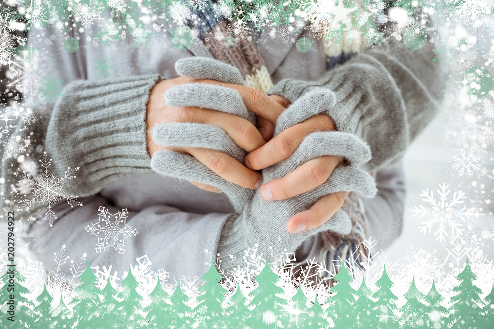 Cute couple in warm clothing holding hands against snow