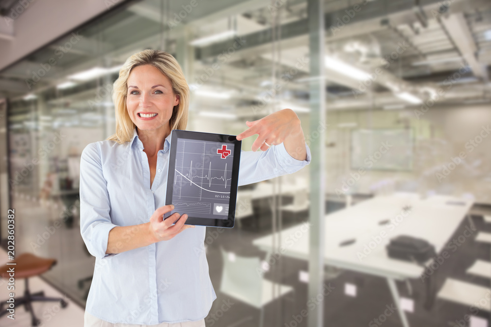 Mature student showing tablet pc against classroom