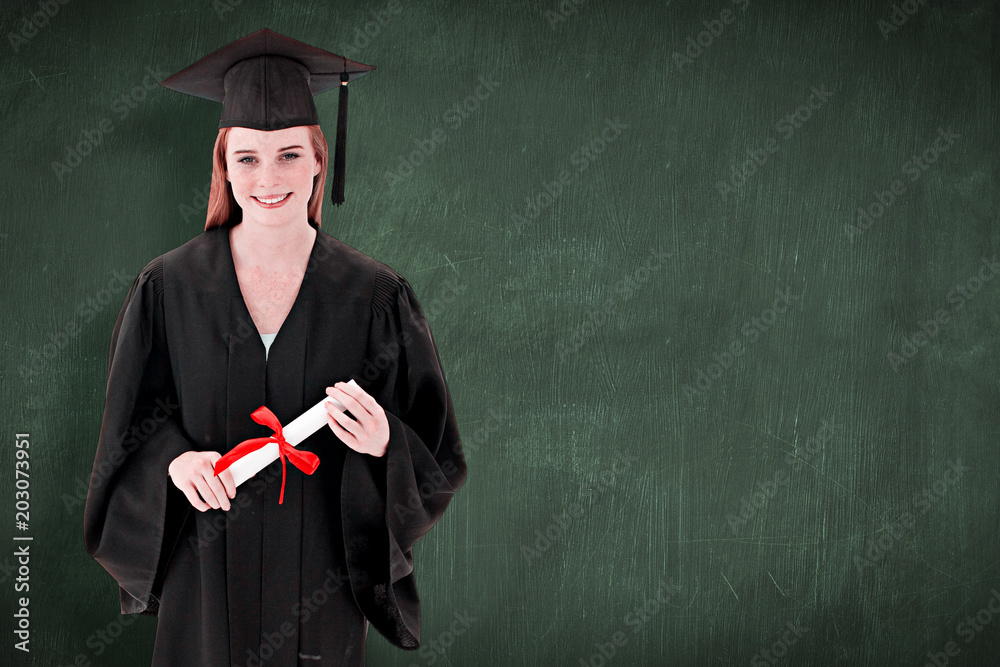 Teenage Girl Celebrating Graduation against green chalkboard