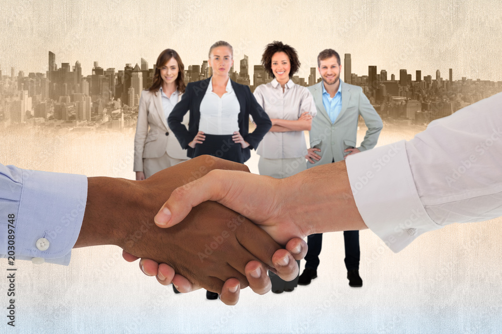 Close-up shot of a handshake in office against cityscape