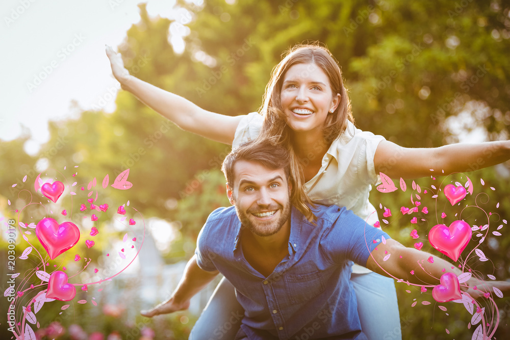 Valentines heart design against smiling young couple having fun 3d