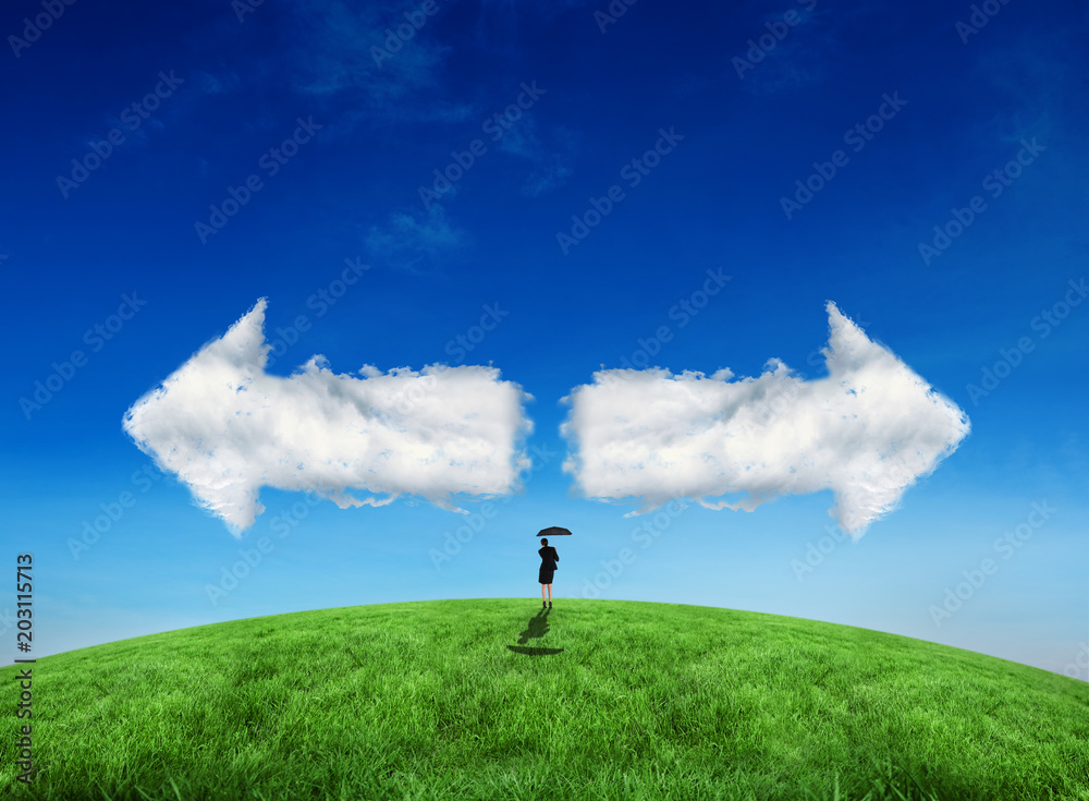 Composite image of young businesswoman holding umbrella against cloud arrows