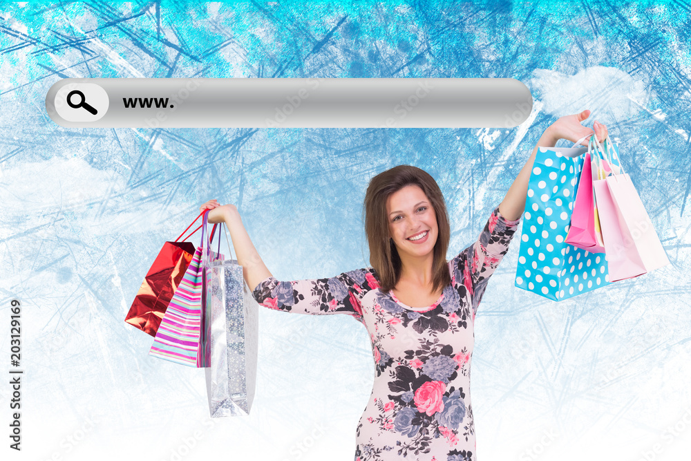 Woman standing with shopping bag against painted sky