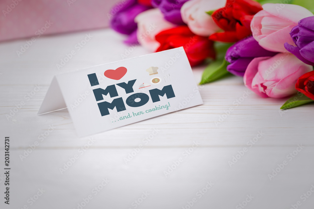 mothers day greeting against tulips with card