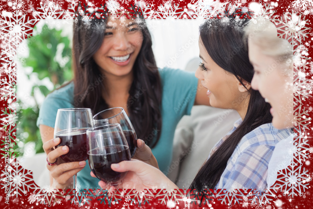 Chatting friends having red wine together against snow