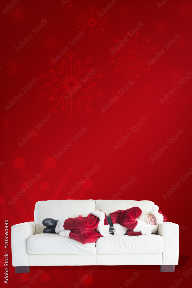 Father Christmas sleeps on a couch against red background