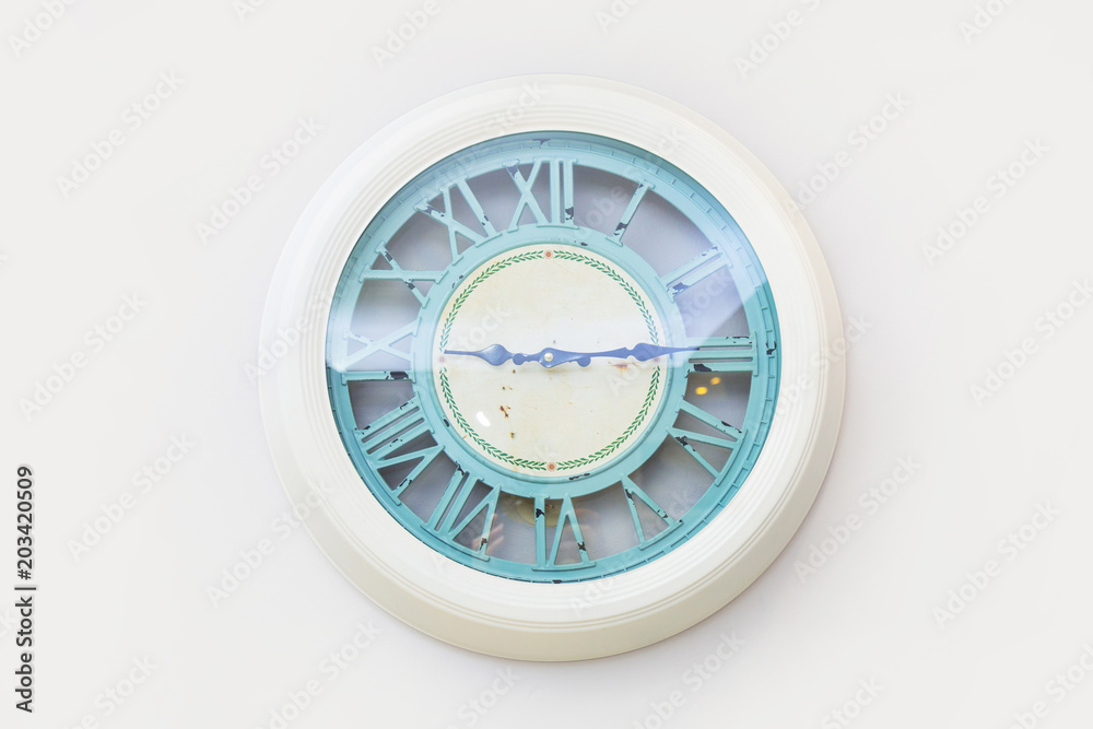 Vintage style clock on white wall