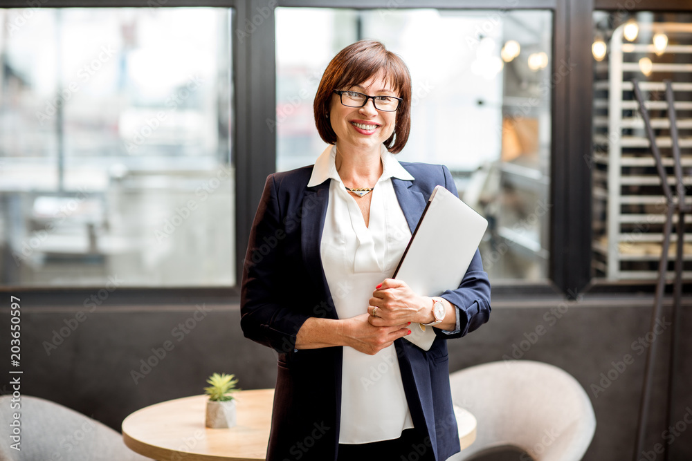 Senior business woman portrait indoors