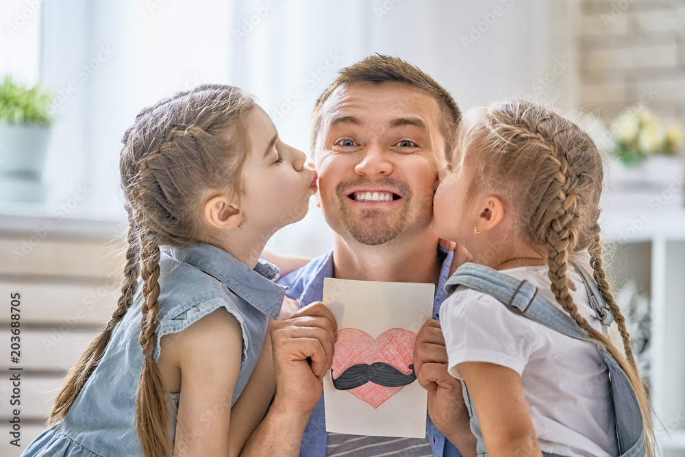 daughters congratulating dad