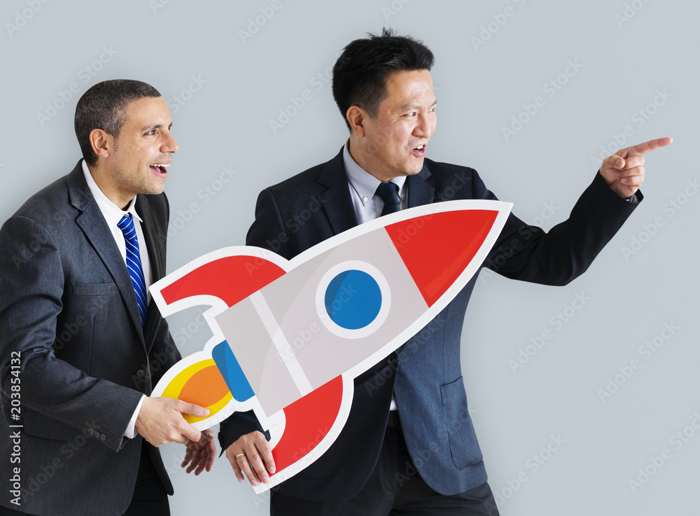 Businessmen holding launching rocket icon