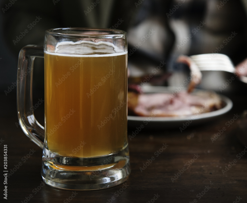 A glass of beer on the table