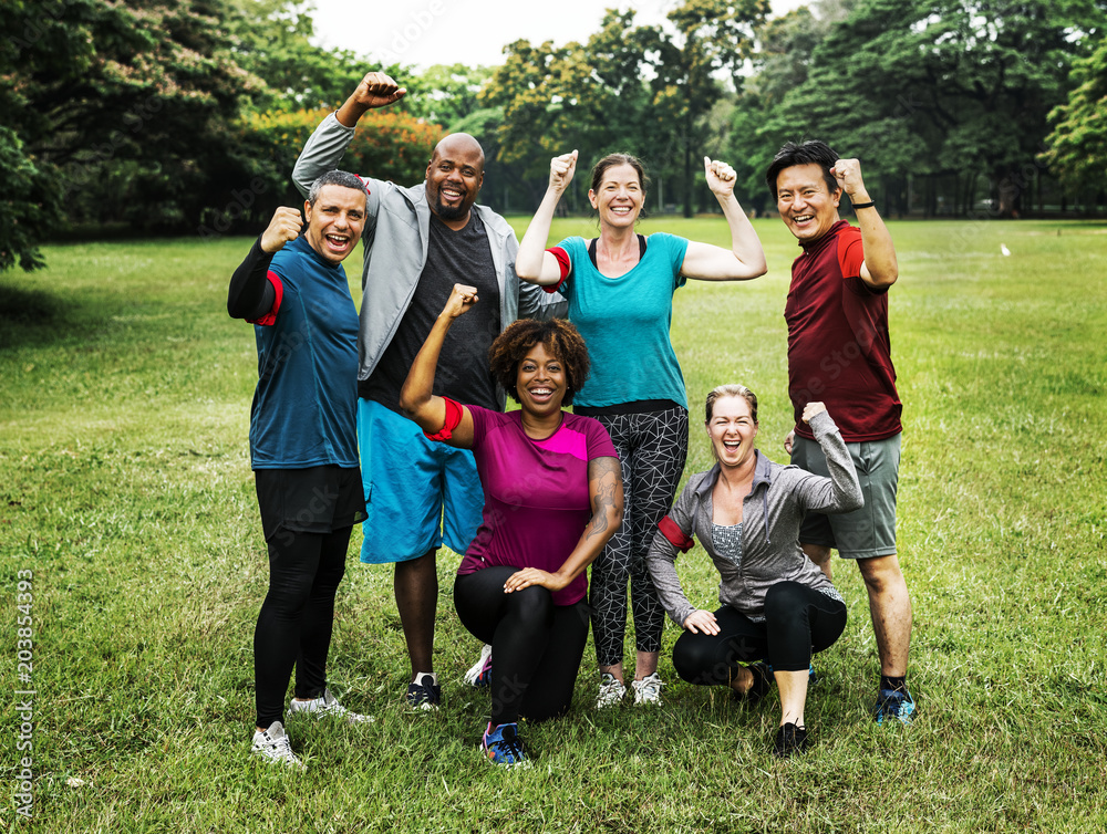 Group of cheerful diverse friends in the park