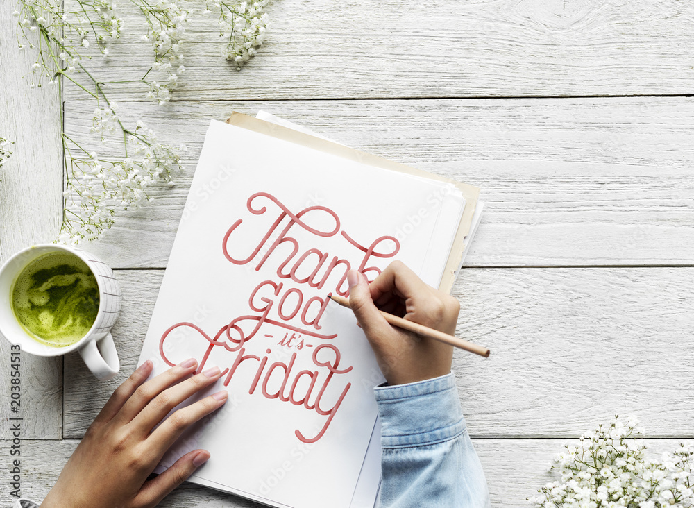 An artist creating hand lettering artwork from motivation quote