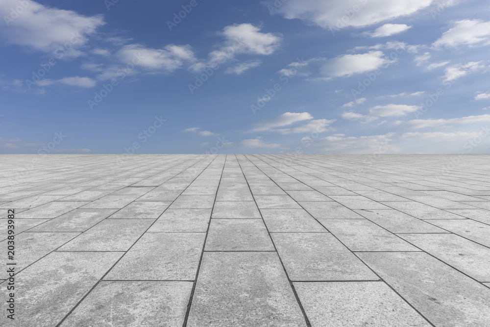 Empty square floor tiles and beautiful sky landscape