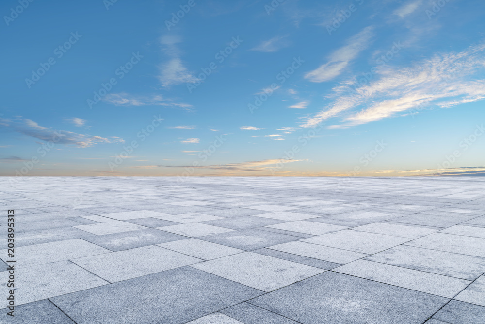 Empty square floor tiles and beautiful sky landscape